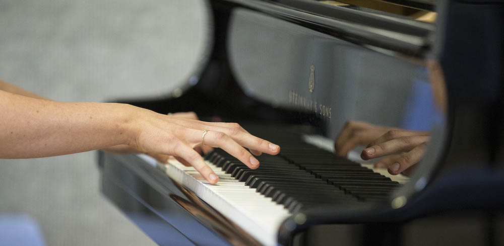 How to Contact Debbi Clarke 1 Debbi Clarke | Musical Director, London | Contact Page | Image shows hands playing piano.
